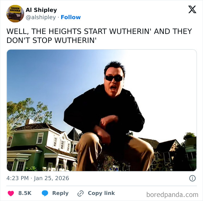 Man wearing sunglasses and black jacket performing a humorous pose in a suburban neighborhood UK, illustrating unique UK living tweets.