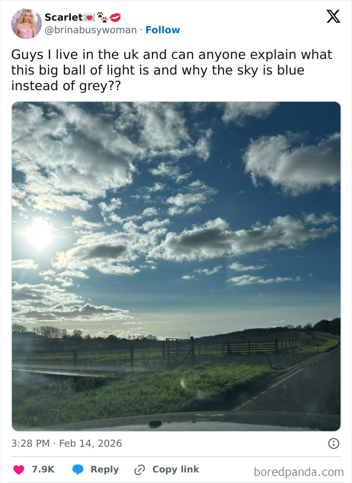 Tweet showing a bright blue sky and countryside, humorously highlighting living in the UK as a unique experience.