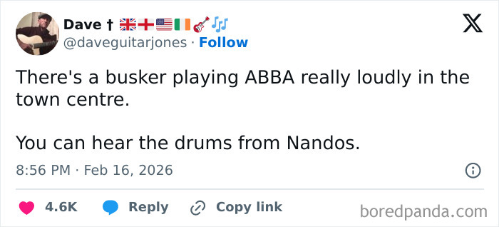 Tweet about a busker playing ABBA loudly in the UK town centre, illustrating unique living experiences in the UK.