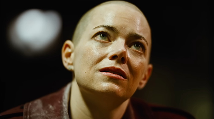 Close-up of a thoughtful person with a shaved head, illustrating Bored Panda's crystal ball Oscar predictions trends for 2026.