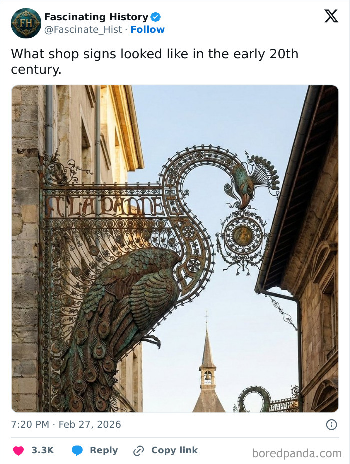 Intricate early 20th-century shop sign shaped like a peacock showcasing historical treasures and advanced craftsmanship.