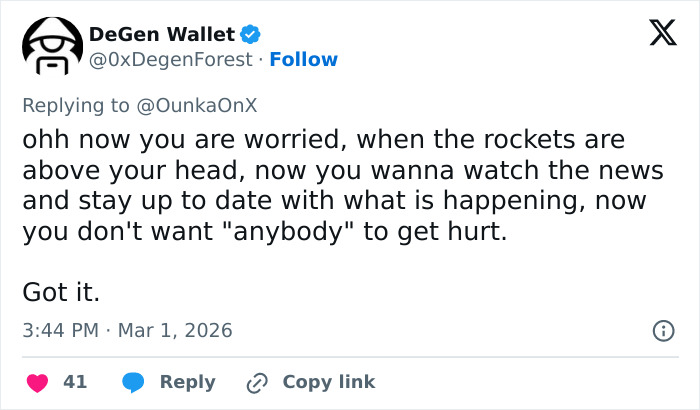 Tweet from DeGen Wallet criticizing influencers rushing to film amid Iran Dubai strikes, sparking public fury.