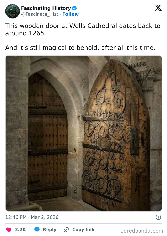Ancient wooden door with intricate ironwork at Wells Cathedral, an interesting historical treasure showing past advanced craftsmanship.