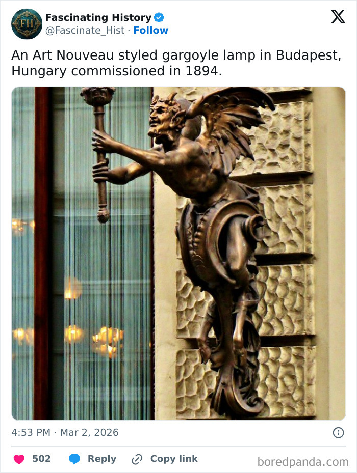 Art Nouveau styled gargoyle lamp on a Budapest building showcasing interesting historical treasures from the past.