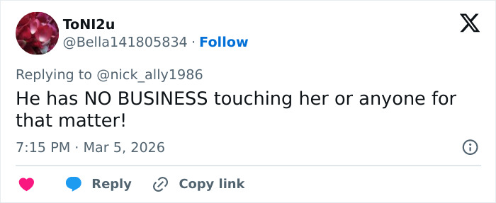 Tennis star Elena Rybakina wearing white outfit, awkwardly pushing presenter’s hand away during trophy ceremony.