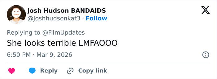 Margot Robbie at Paris Fashion Week, fashion critics and fans sharing mixed reactions on social media.