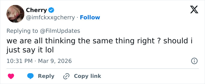 Screenshot of a social media reply discussing reactions to Margot Robbie&rsquo;s Paris Fashion Week appearance in Hollywood.