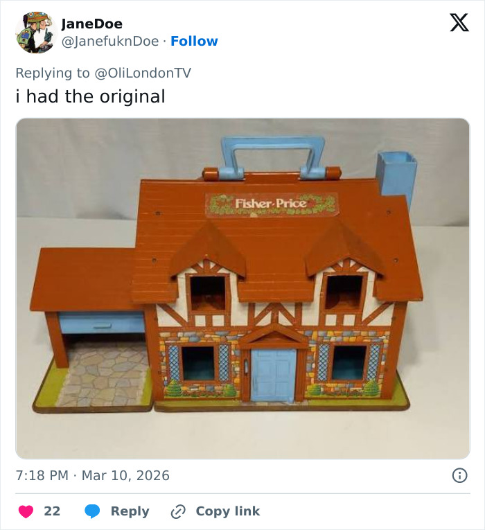 Fisher Price toy house with brown roof and blue door, vintage playset resembling a classic family home tour bag.