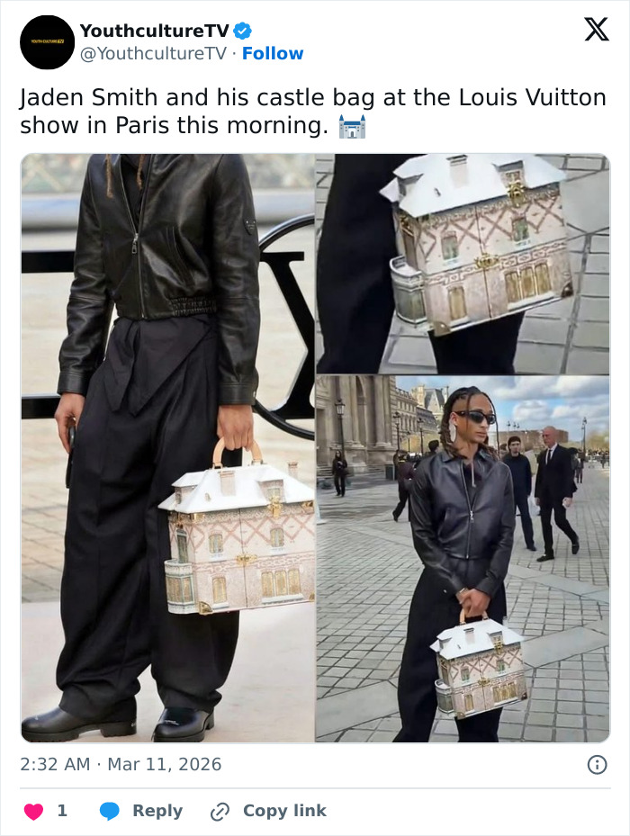 Jaden Smith holding a detailed castle-shaped house bag at the Louis Vuitton show in Paris, dressed in black leather.