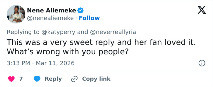 Tweet by Nene Aliemeke replying to Katy Perry about her grim response to struggling fan, sparking backlash from many users.
