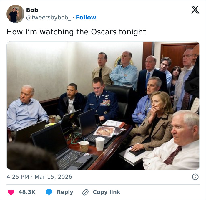Group of serious people intently watching multiple laptops, capturing Oscars memes and viewers reactions humor.