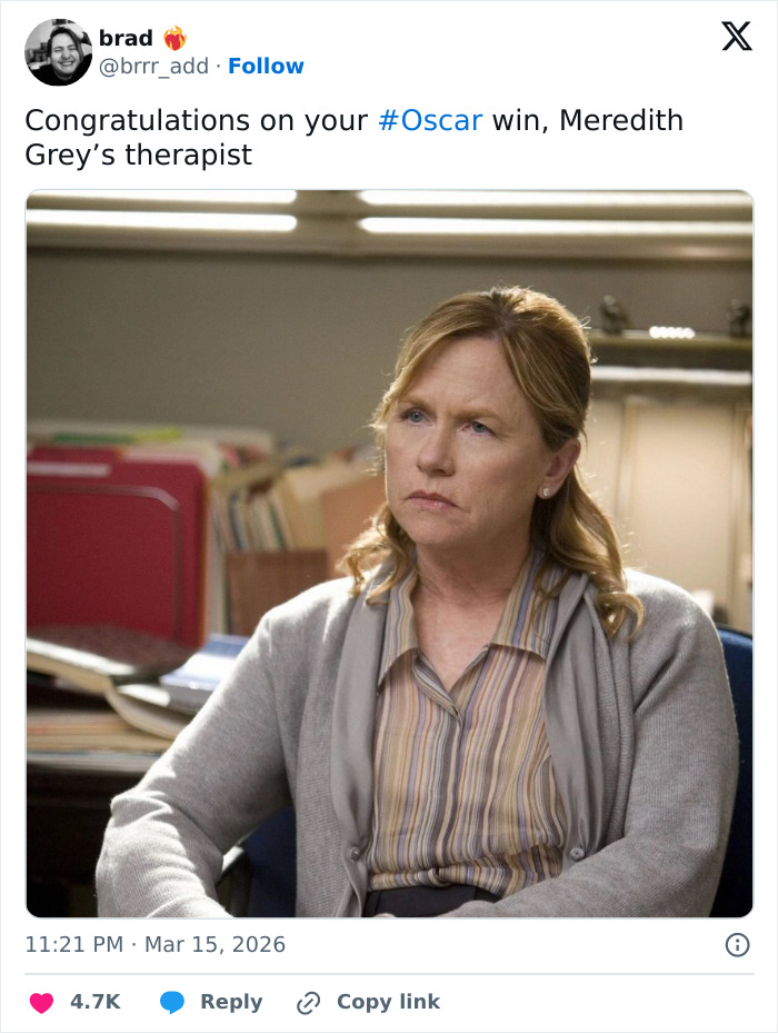 Woman with serious expression sitting in an office, featured in a humorous Oscar memes tweet about viewers' reactions.