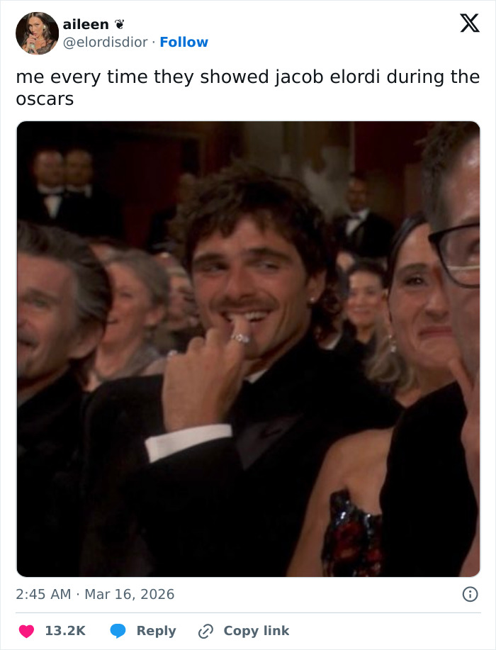 Actor smiling subtly at the Oscars event, capturing the spirit of Oscars memes and viewers' reactions to the ceremony.