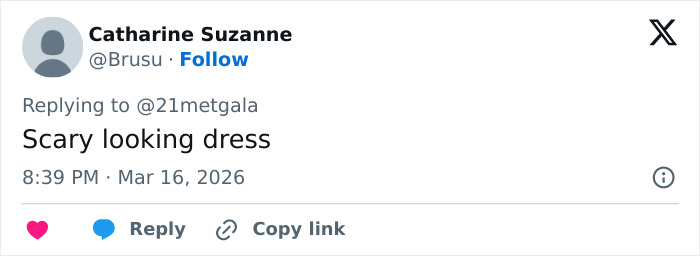 Tweet by Catharine Suzanne commenting on a scary dress, reacting to a fashion event discussion.