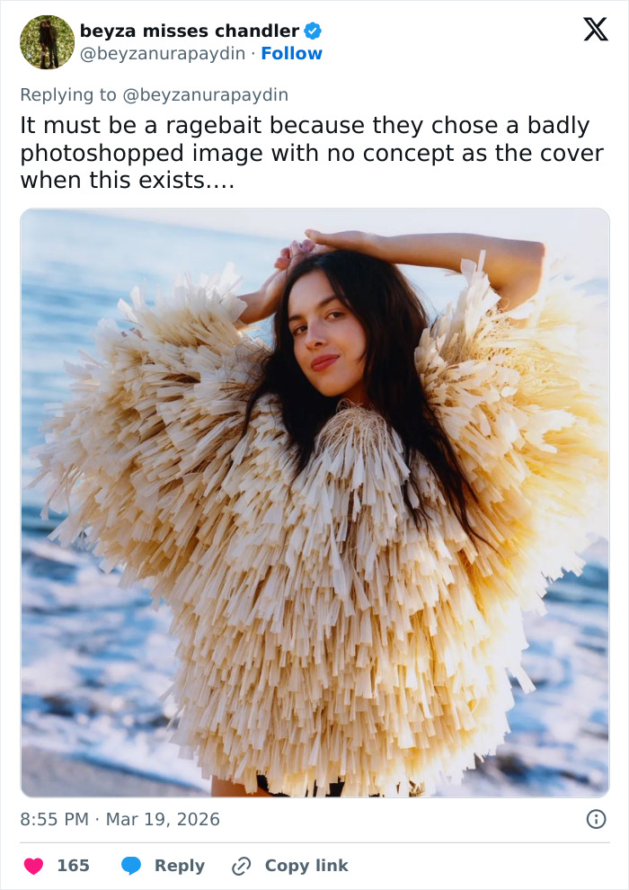 Olivia Rodrigo posing by the ocean in a textured feather-like outfit amid fan reactions to Vogue cover controversies. Olivia Rodrigo posing by the ocean in a textured feather-like outfit amid fan reactions to Vogue cover controversies.