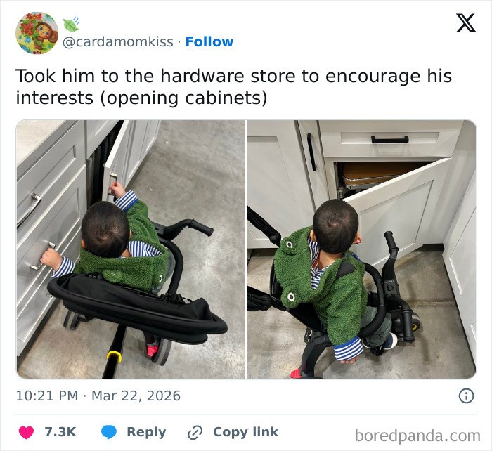 Toddler in a green jacket exploring struggles parents face by opening cabinets at a hardware store in a relatable parenting moment.