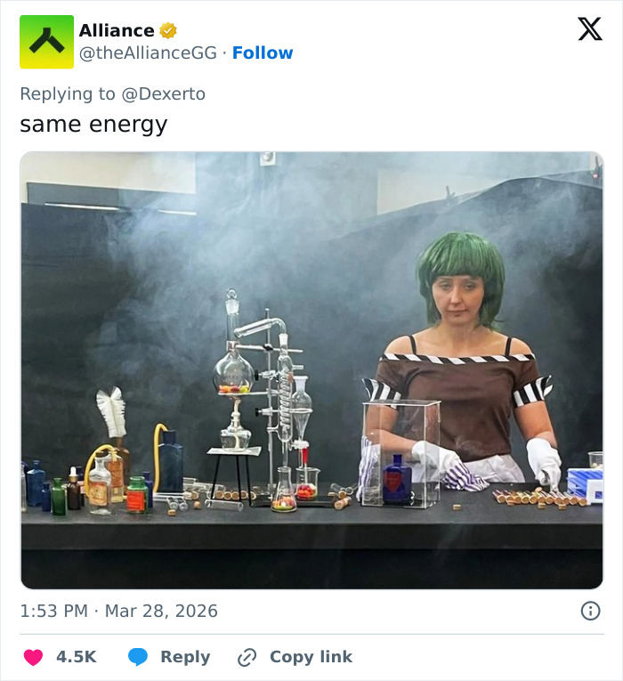 Woman with green wig in a smoky lab setup resembling a W***y Wonka style experience at Barbie Dream Fest event