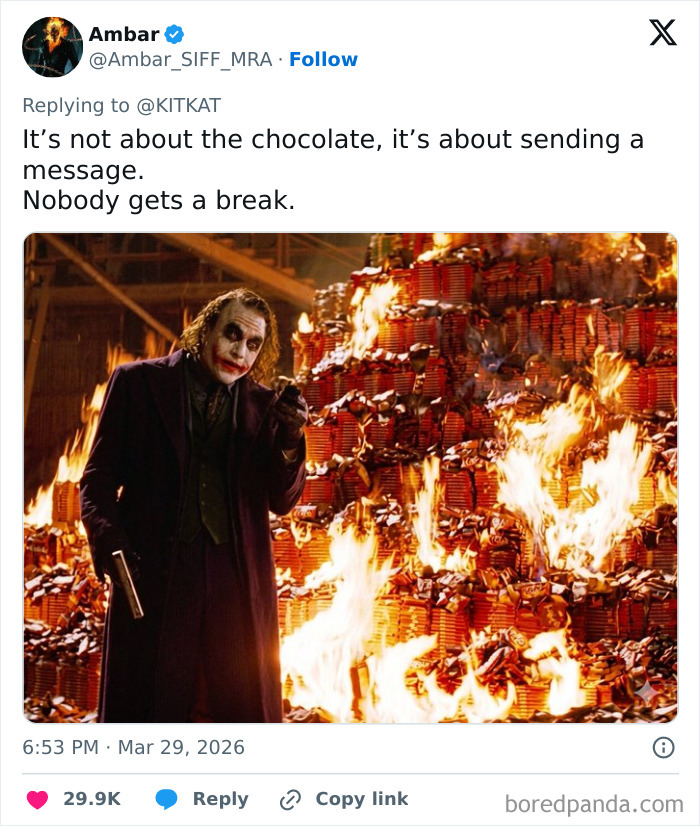 Alt text: Joker character standing next to a massive pile of burning KitKat bars, referencing 12 tons of KitKat stolen with humorous responses.