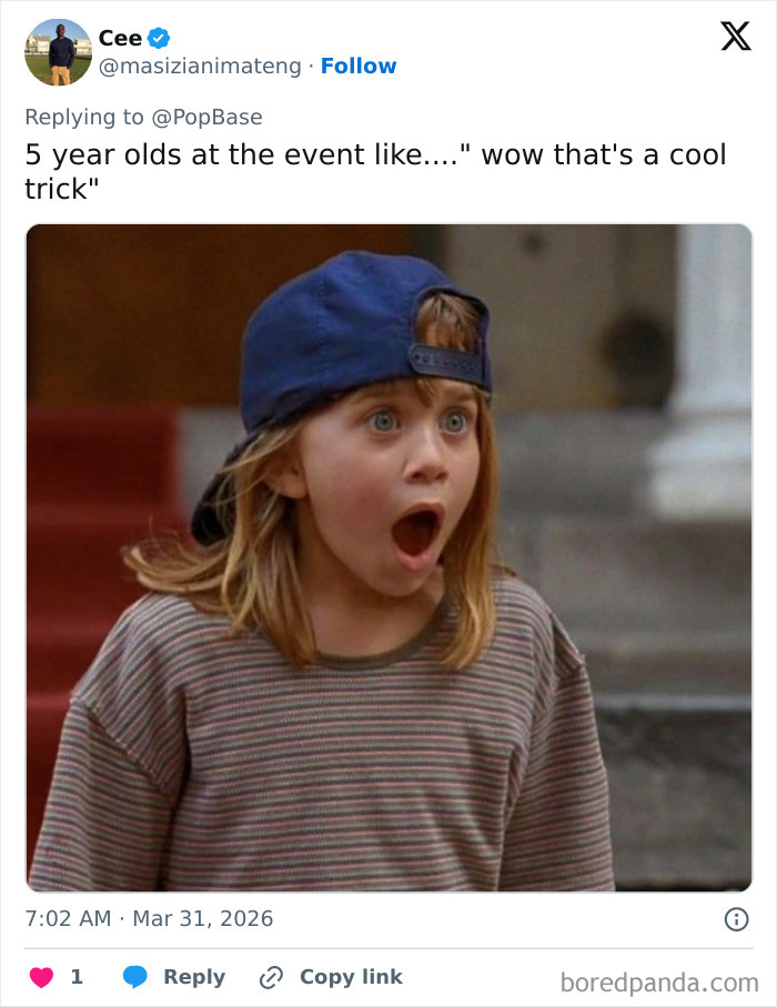 Young child wearing a blue cap with a shocked expression reacting to Disney’s animatronic Olaf collapsing in front of fans.