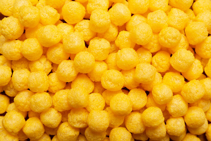 Close-up of yellow snack balls illustrating bizarre encounters that left folks questioning for years what they saw.