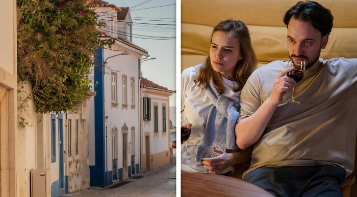Couple sitting indoors drinking wine, appearing deep in thought while discussing ethical and moral dilemmas.