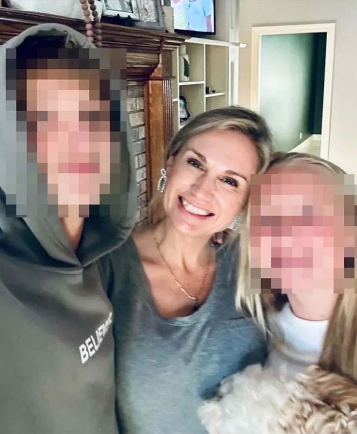 Former Mayor Misty Roberts smiling with two people in a cozy living room setting, religious symbols blurred in background.