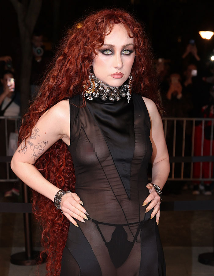 Chappell Roan in sheer black dress and bold jewelry, turning heads with daring look at Paris Fashion Week.
