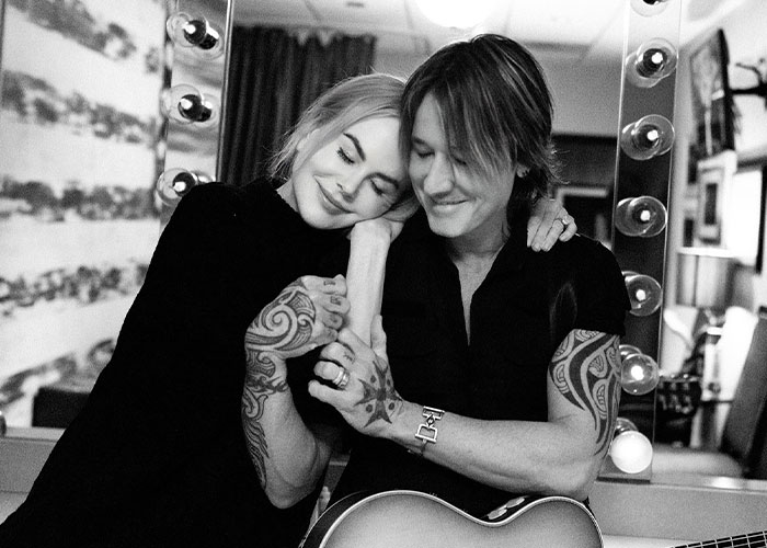Nicole Kidman and Keith Urban sharing a tender moment, highlighting news about their divorce and relationship.