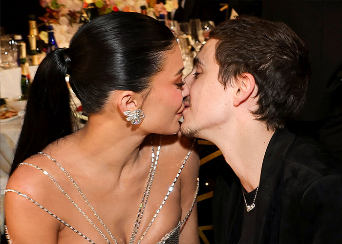 Timoth&eacute;e Chalamet sharing a close moment at a formal event, reflecting on claims about his Oscar chances and attitude.