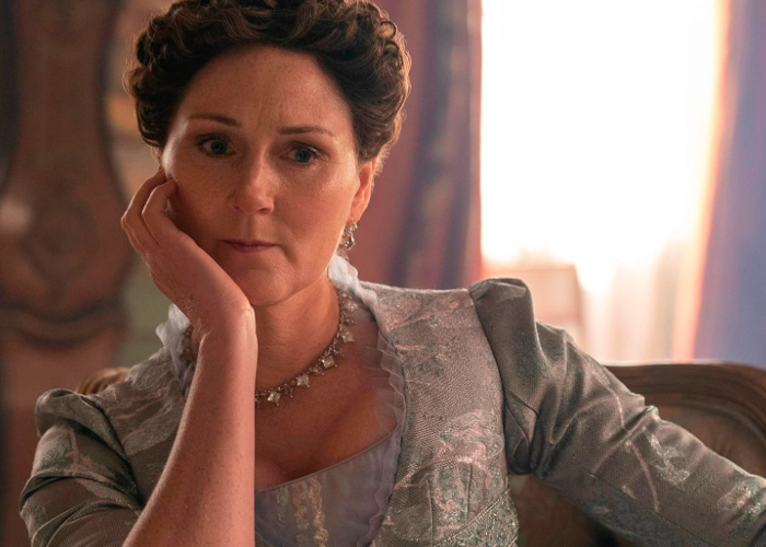 Ruth Gemmell from Bridgerton looking emotional after filming an intimate sequence in period costume indoors.