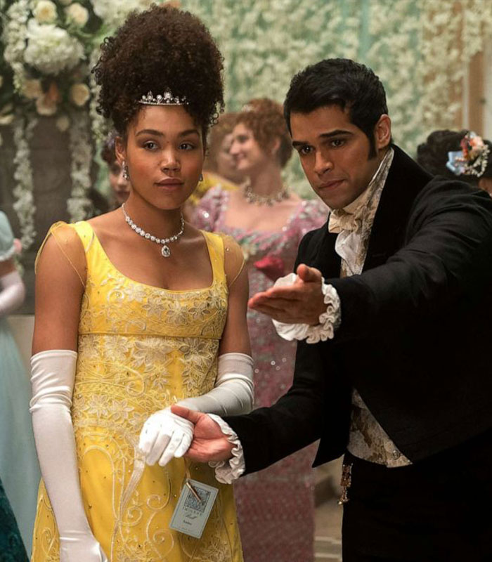 Actress from Bridgerton in a yellow gown and gloves at a formal event, highlighting mental health impact on her body.