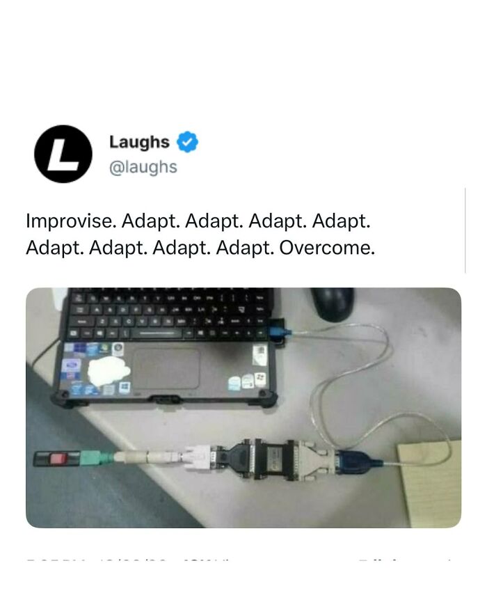 Laptop connected with a long series of adapters and cables illustrating funny memes about adapting and overcoming tech challenges.