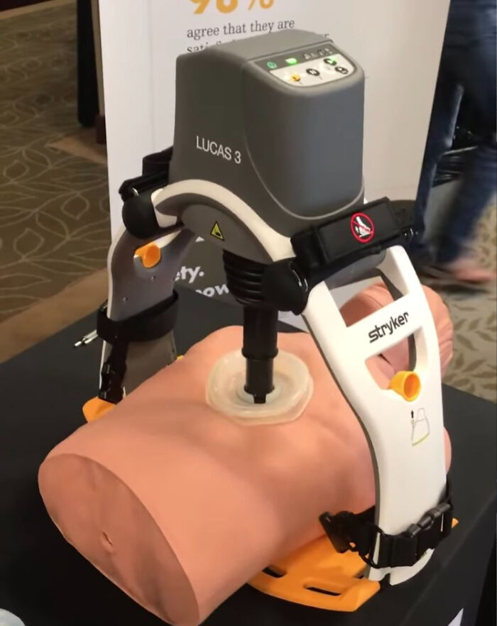 Medical device demonstrating automated chest compressions on a training mannequin, highlighting challenges medical staff face in the ER.