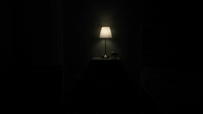 A dimly lit bedroom with a bedside lamp glowing, evoking childhood memories and nostalgic moments.