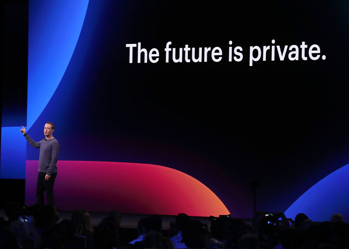 Meta worker presenting on stage in front of slide about privacy, discussing users' smart glasses concerns.