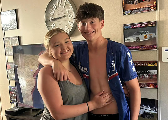 Teen boy and girl smiling and hugging indoors, related to controversial case of 15-year-old pregnant by 12-year-old update.