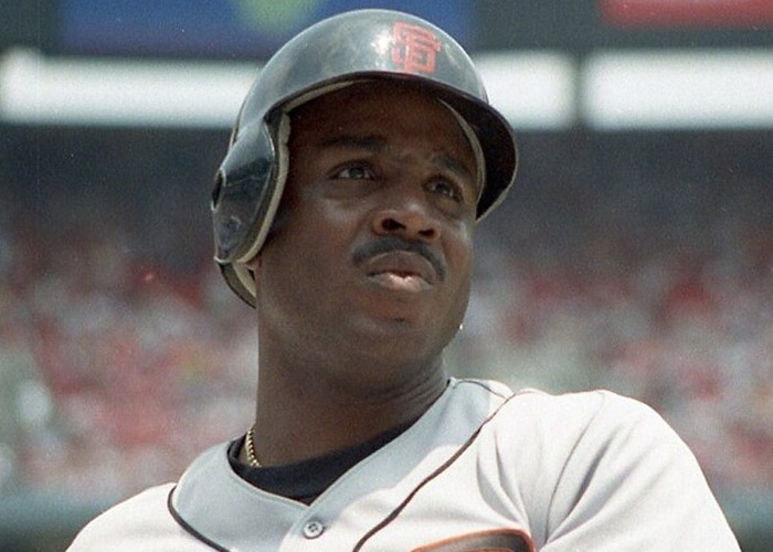 Baseball player wearing a helmet and jersey, captured during a game, illustrating celebrity encounters and raging jerks.