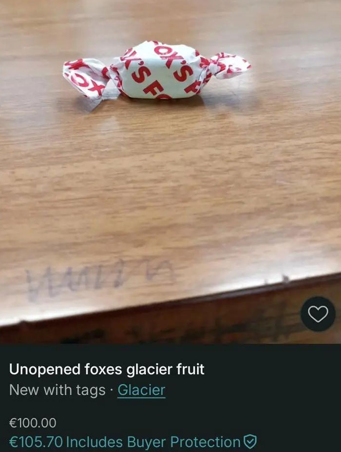Single wrapped candy on a wooden surface listed on Vinted proving hilarious listings with zero rules on Vinted platform.