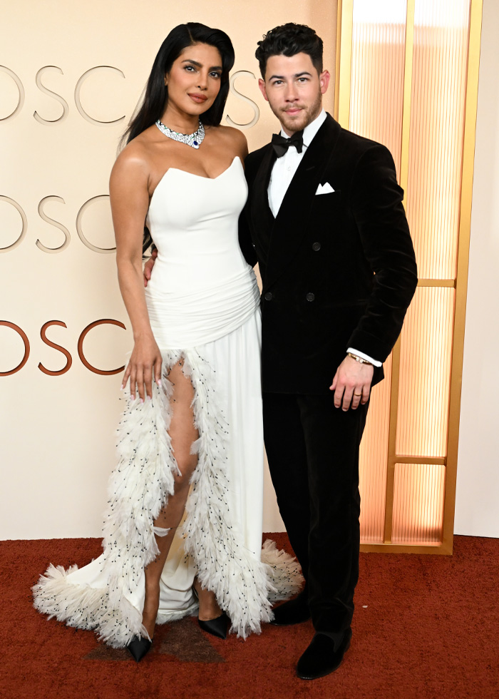 Couple dressed in elegant outfits at Oscars 2026 red carpet showcasing jaw-dropping fashion that left fans speechless.