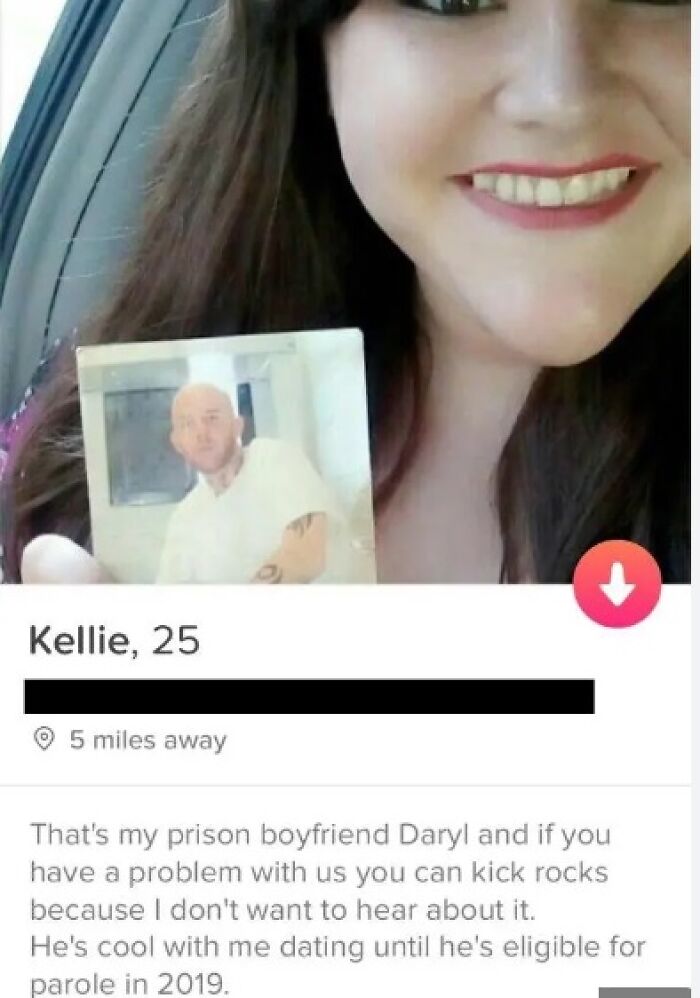 Woman smiling in a Tinder profile holding a photo of her prison boyfriend, showcasing funny and cringe-worthy Tinder profiles.