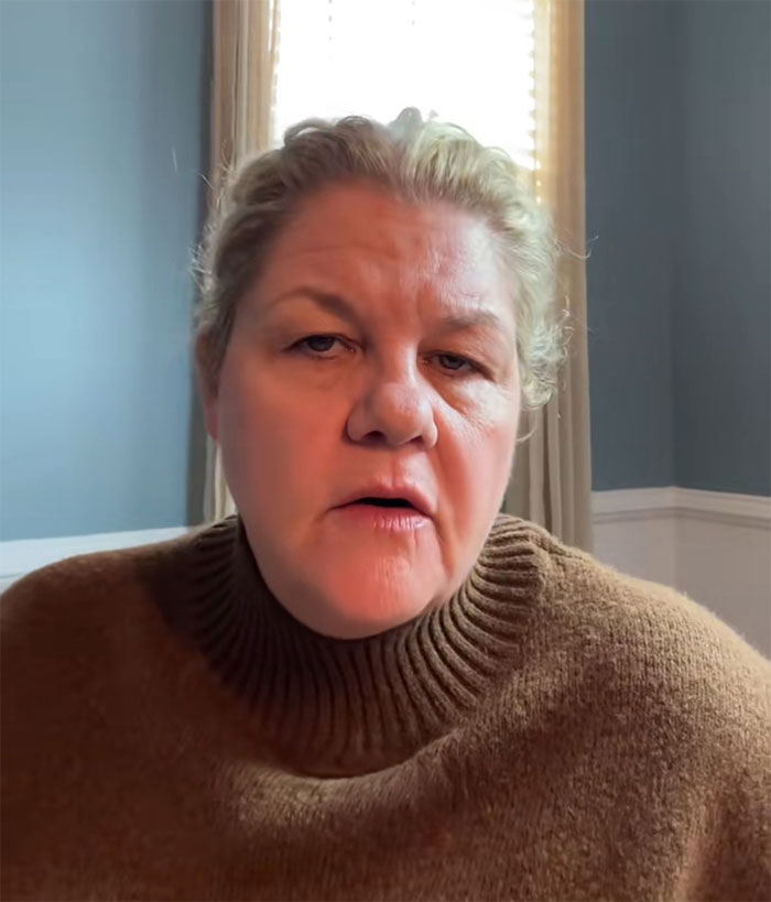 Middle-aged woman in a brown sweater speaking indoors, illustrating HR dumbfounded when employee refuses free training tasks. Middle-aged woman in a brown sweater speaking indoors, illustrating HR dumbfounded when employee refuses free training tasks.