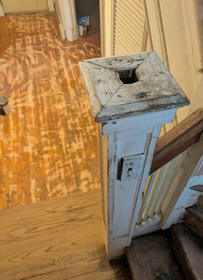 Worn wooden banister post with an old light switch reveals disturbing and weird things found in abandoned homes.