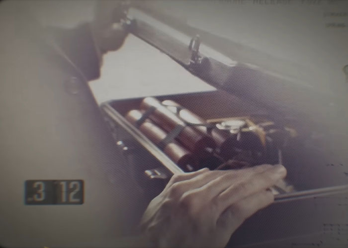 Close-up of a hand opening a briefcase with explosives, related to FBI update on infamous 1971 plane hijacker DB Cooper. Close-up of a hand opening a briefcase with explosives, related to FBI update on infamous 1971 plane hijacker DB Cooper.