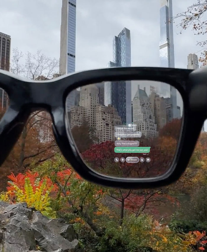 View through smart glasses showing a cityscape with AR text messages, illustrating Meta workers' experiences with smart glasses.