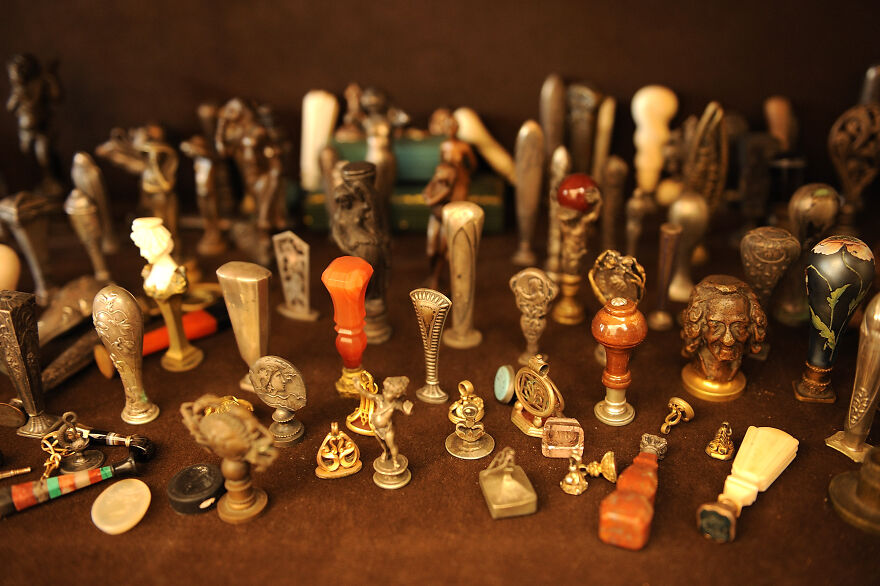 Assortment of curious objects with intricate designs displayed closely, highlighting their dazzling and unique origins.