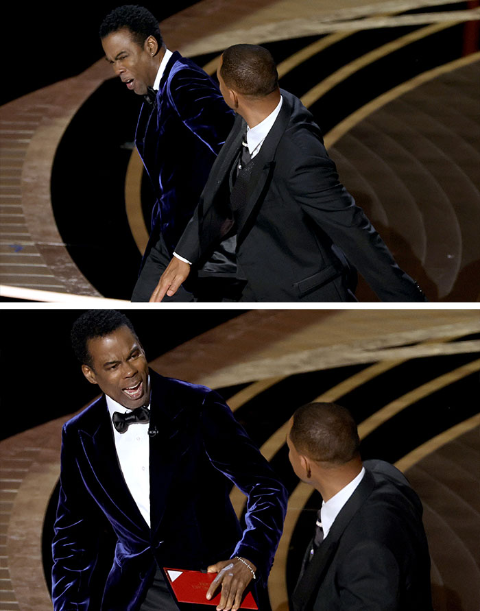 Two men in tuxedos having an awkward moment onstage at the Oscars, showcasing celebrity secondhand embarrassment.