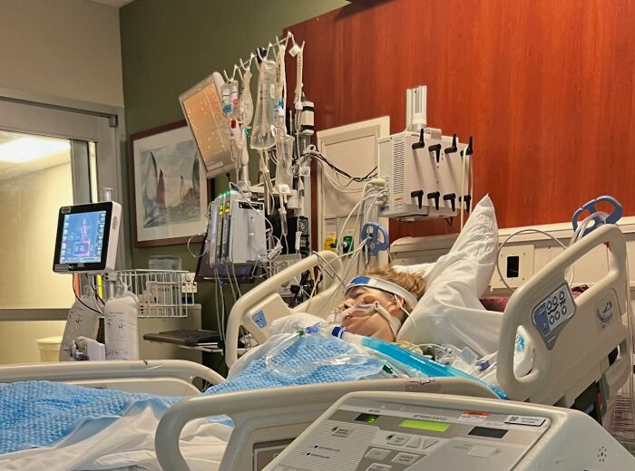 Patient in hospital bed connected to numerous medical machines, illustrating disturbing real life scenes and facts.