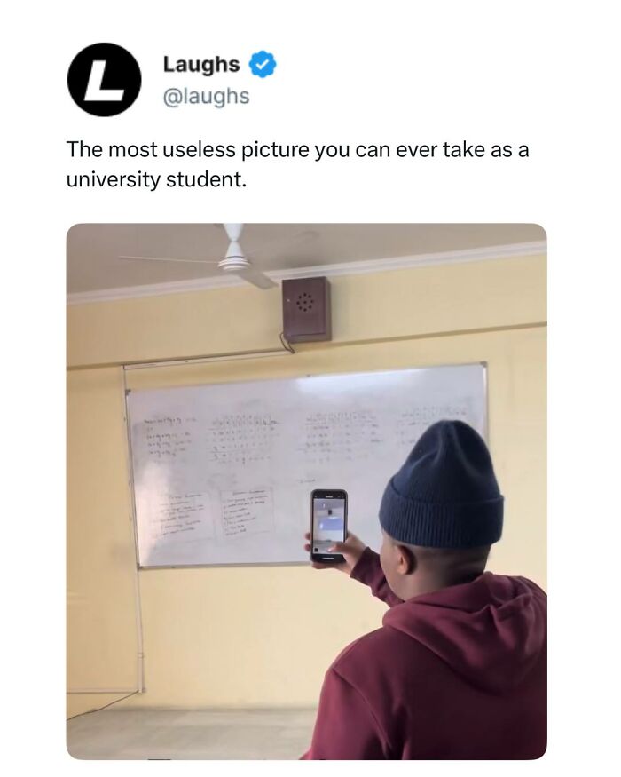 Student wearing a beanie taking a photo of a whiteboard in a classroom, a funny meme about university life and memes.