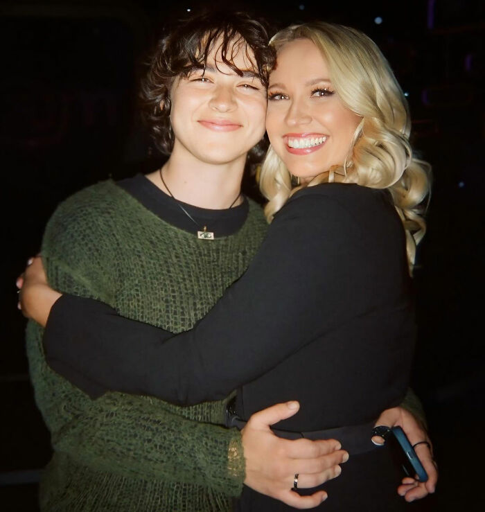 Anna Camp smiling and hugging a partner, highlighting her sexuality and age-gap romance confirmation.