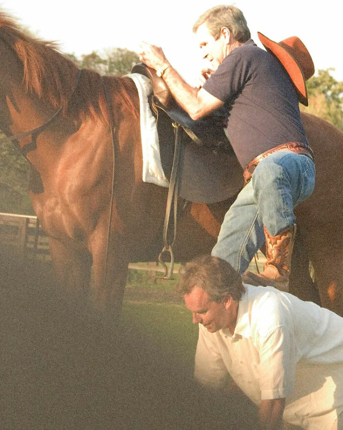 Blair Assists Bush Mounting His Horse